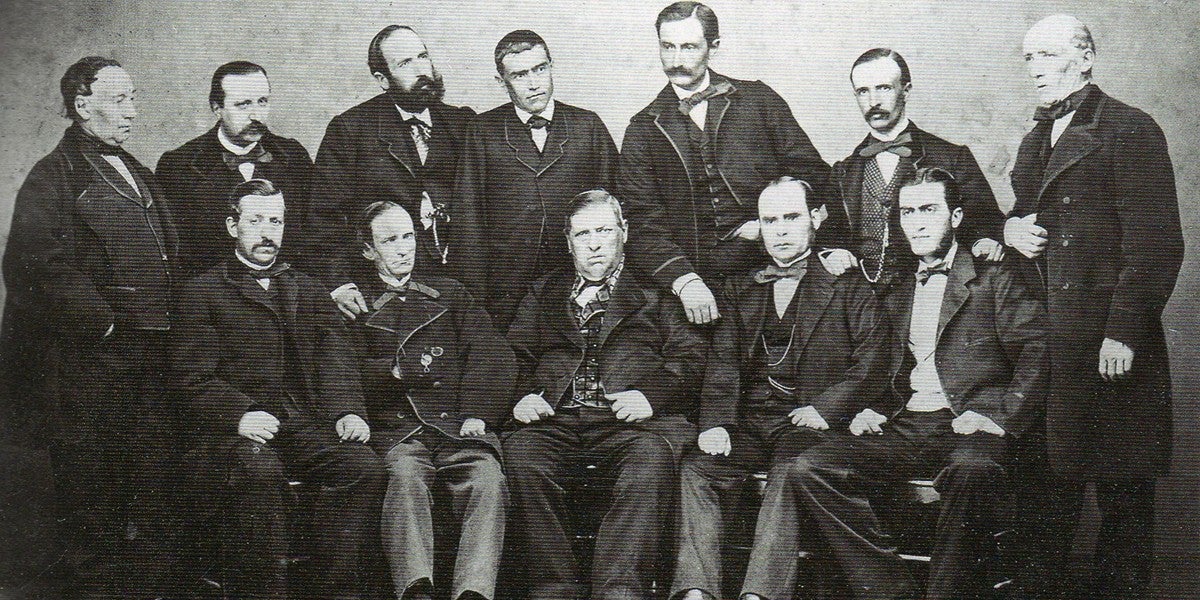 Fundadors del Institut Industrial de Sabadell (1864). Asseguts, d'esquerra a dreta: Pere Bulbena Oñós, Josep de C. Duran Mimó, Pere Turull Sallent (al centre), Antoni Serret Palau i Josep Torra Sendra. Drets, d'esquerra a dreta_ Antoni Casanovas Bosch, Pere Folguera Pla, Joan B. Corominas, Joan Gorina Morató, Domènec Buxeda Crehuet, Joan Casanovas Sallarès i Joan Sallarès Marra.